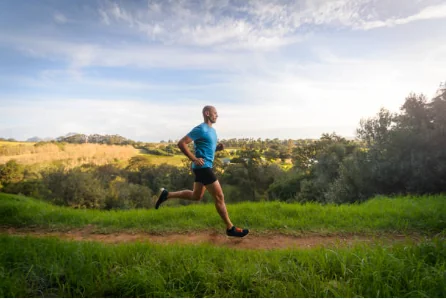 Garrett on a trail run through rolling hills