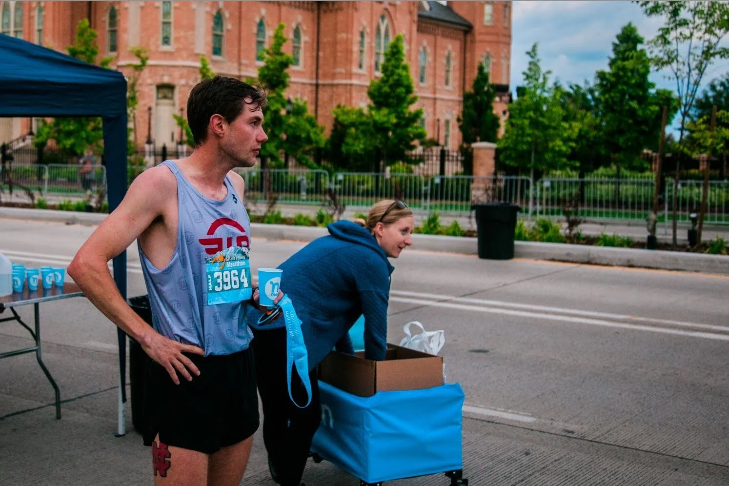 Travis at the half marathon finish line catching his breath