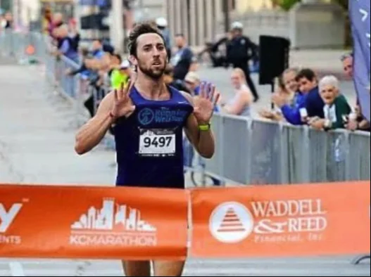 Ryan breaking the tape at the KC Marathon