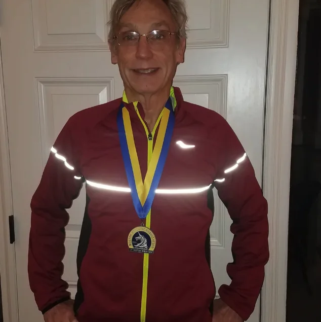 Myles with his marathon finisher medal
